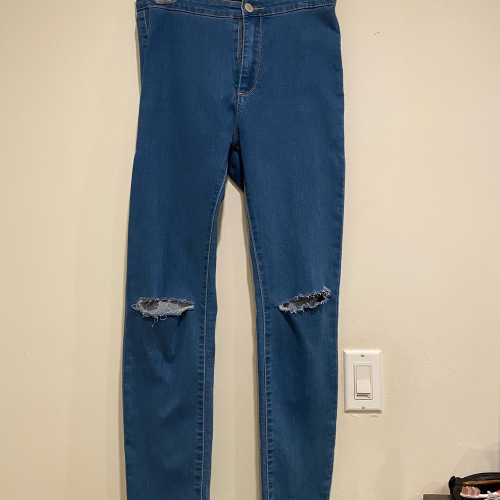 Distressed denim jeans